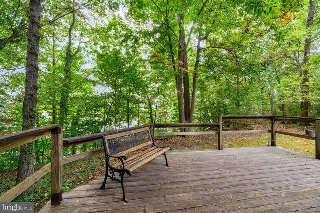 a backyard of a house with a garden and barbeque oven