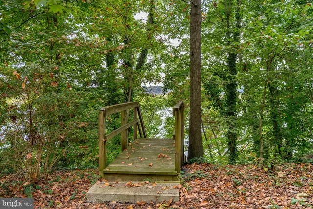 a backyard of a house with yard and outdoor seating