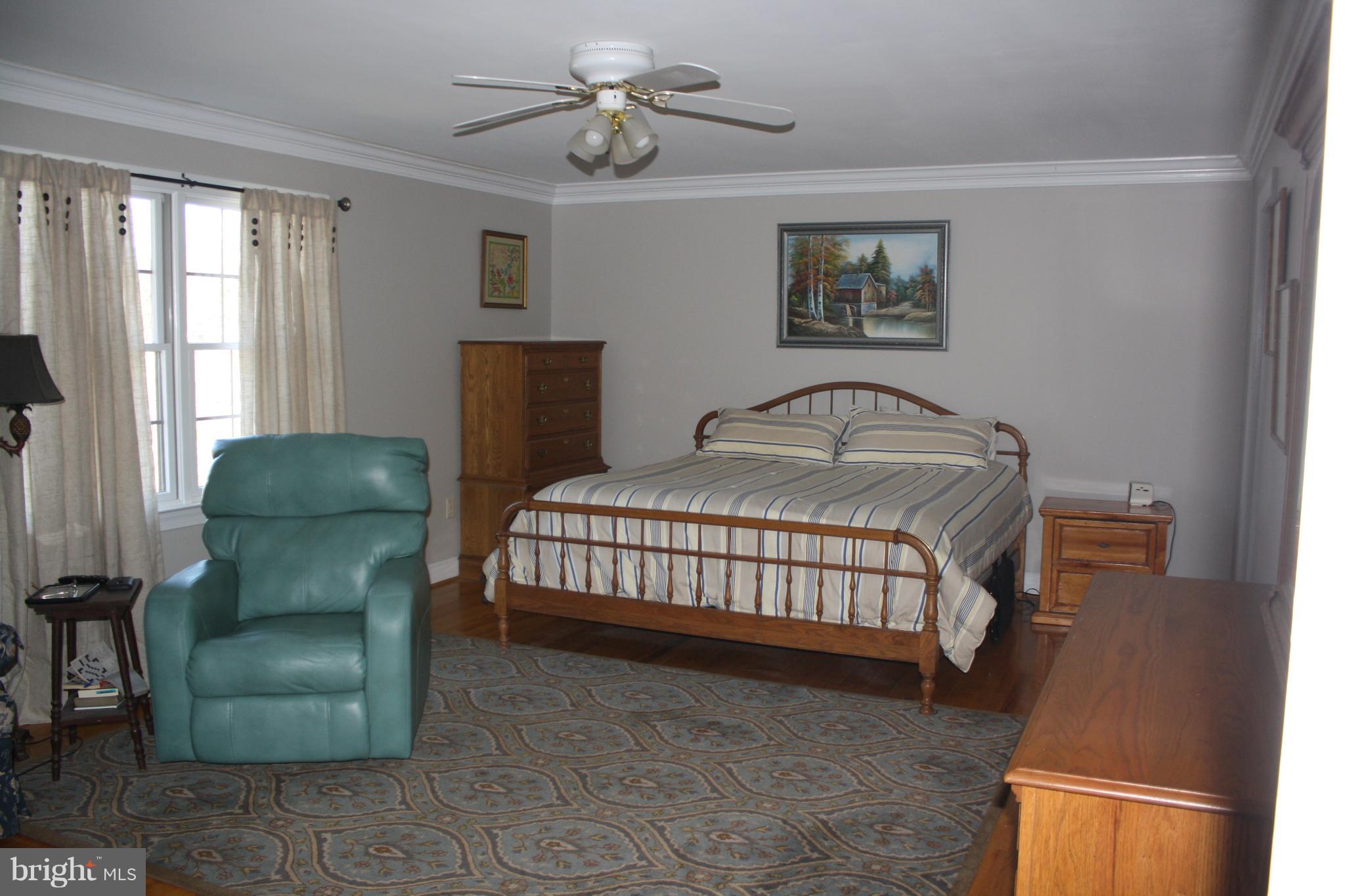 148 Ruth Court Strasburg, VA 22657 - Photo 13 of 30 a bedroom with a bed and a dresser