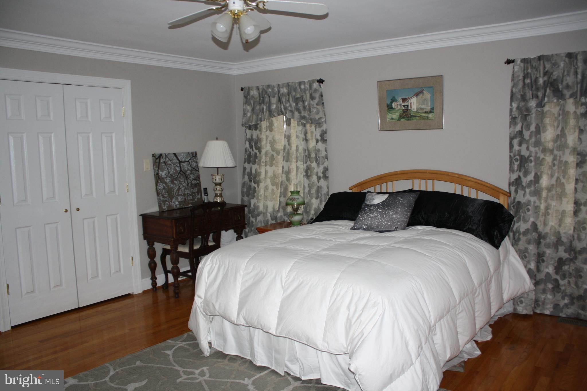 148 Ruth Court Strasburg, VA 22657 - Photo 17 of 30 a bedroom with a bed and a table in it