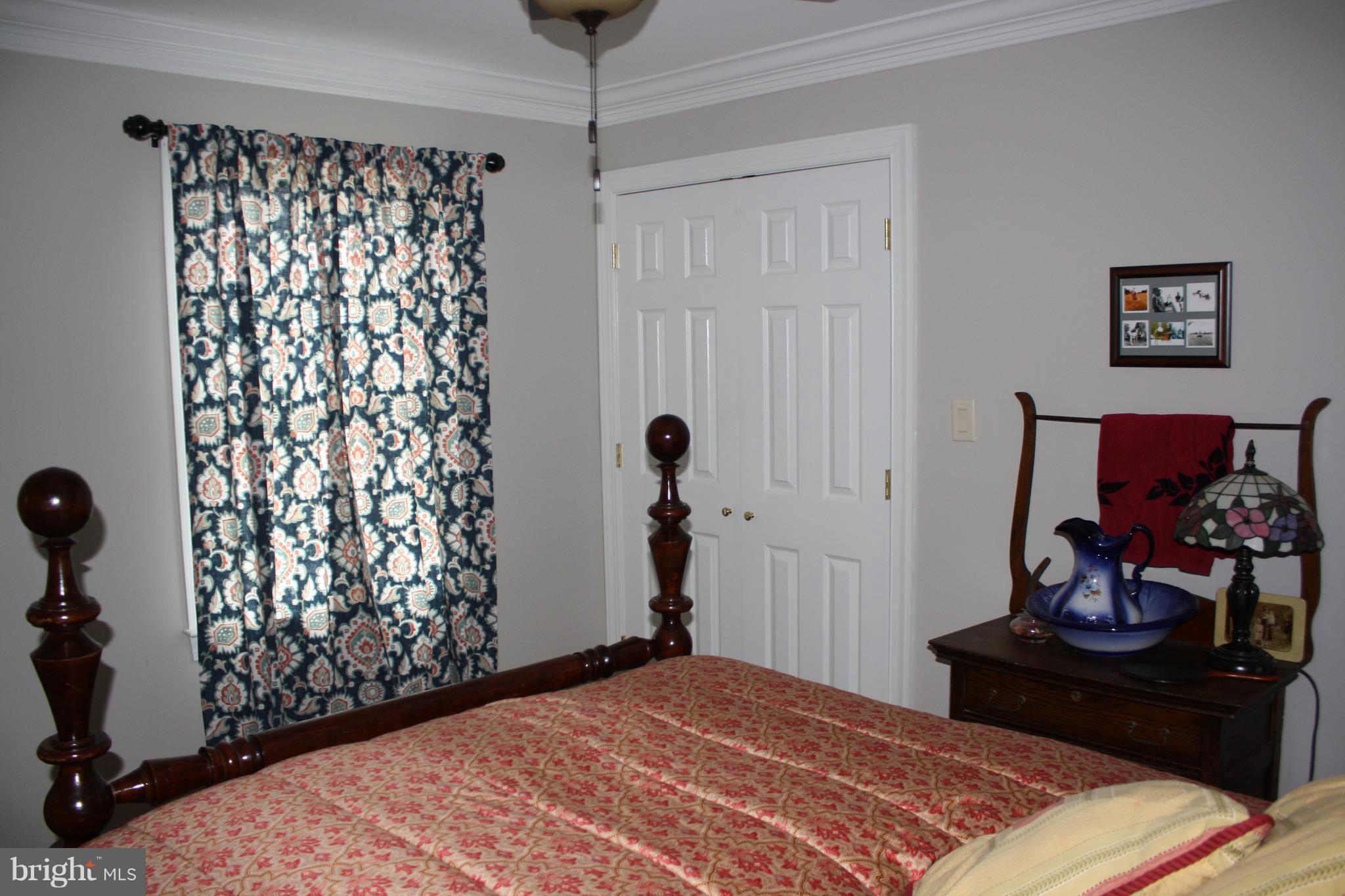 148 Ruth Court Strasburg, VA 22657 - Photo 18 of 30 a bedroom with a bed and a window