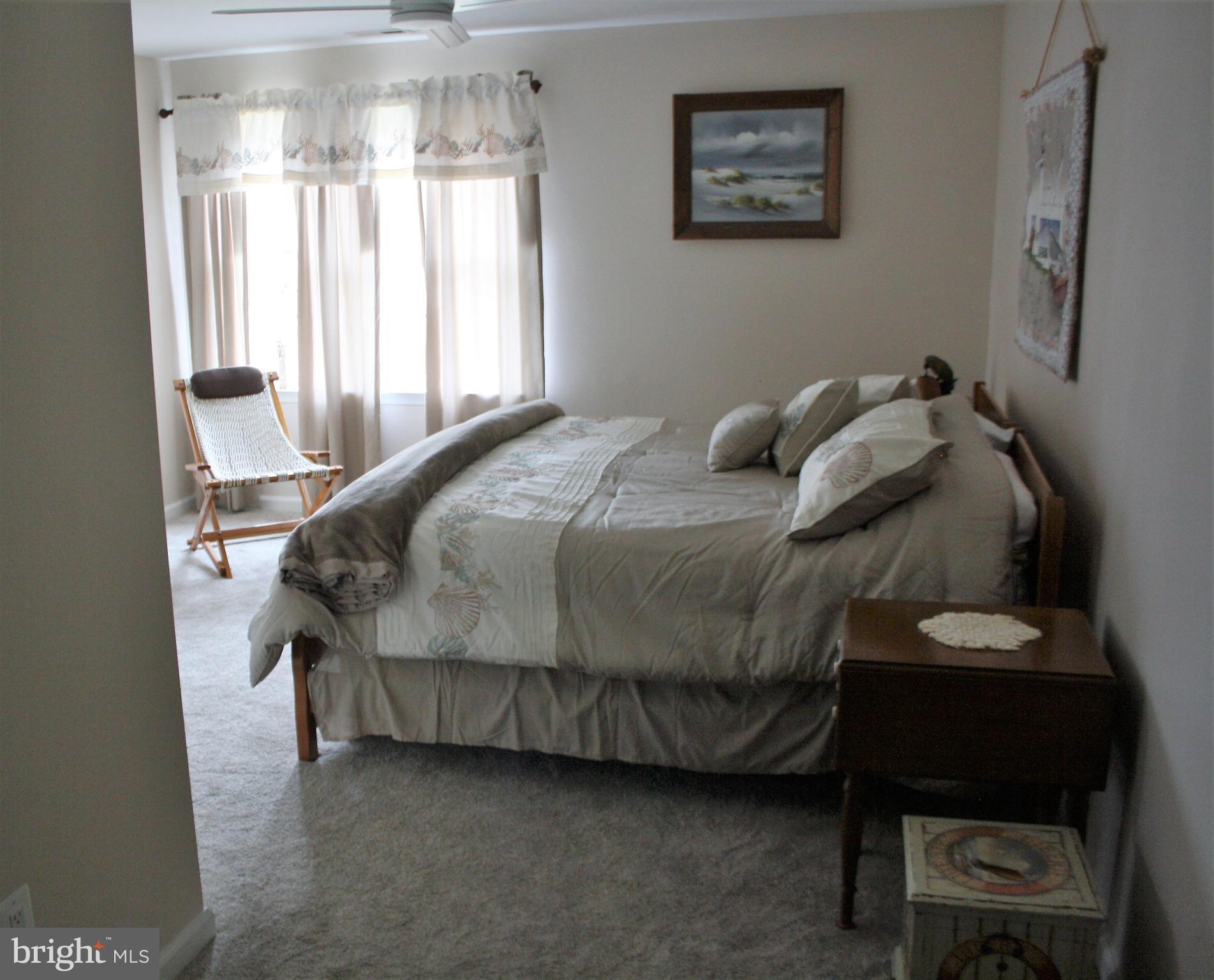 148 Ruth Court Strasburg, VA 22657 - Photo 24 of 30 a bedroom with a bed dresser and a window