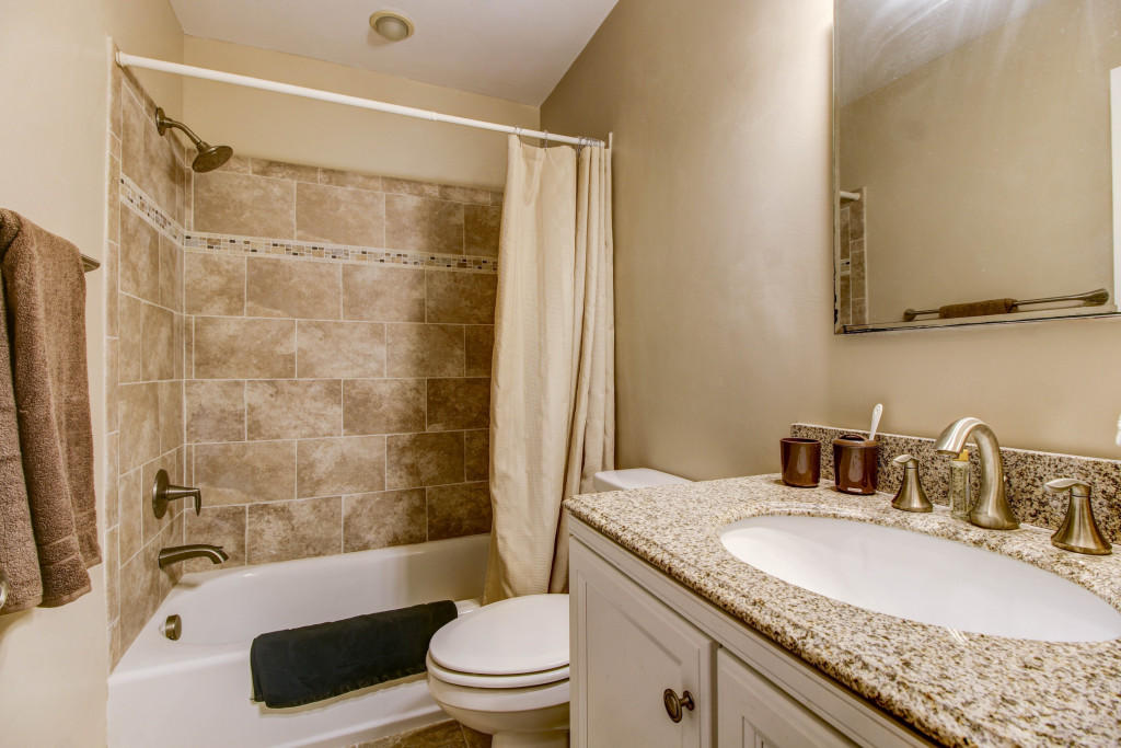 1400 Morgans Mill Road Goodview, VA 24095 - Photo 12 of 21 a bathroom with a granite countertop sink toilet and shower