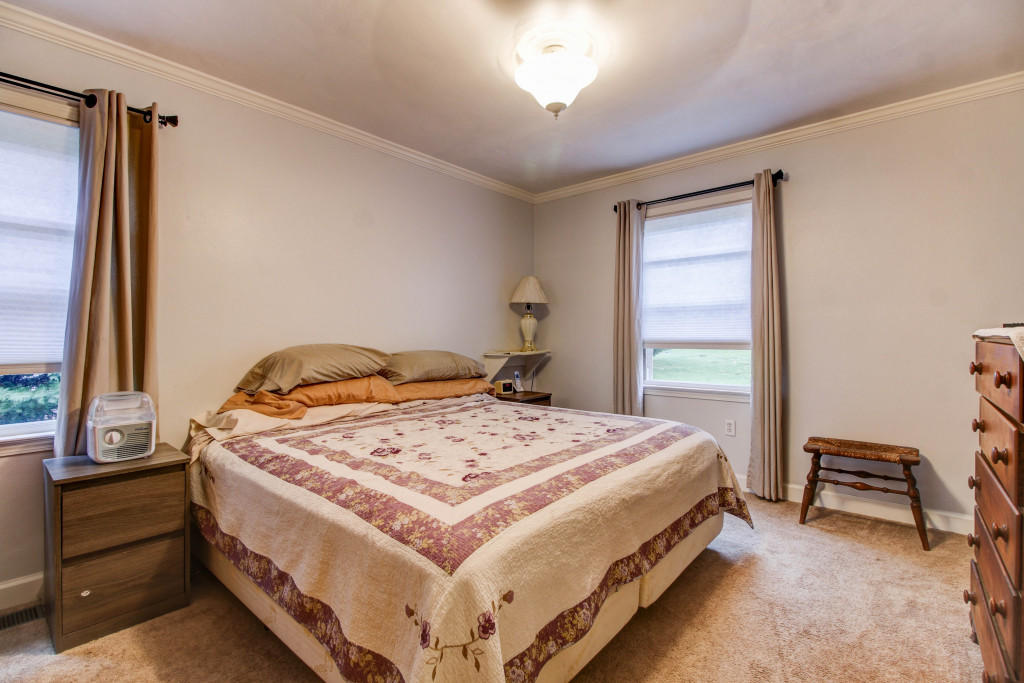 1400 Morgans Mill Road Goodview, VA 24095 - Photo 14 of 21 a bedroom with a bed and a window