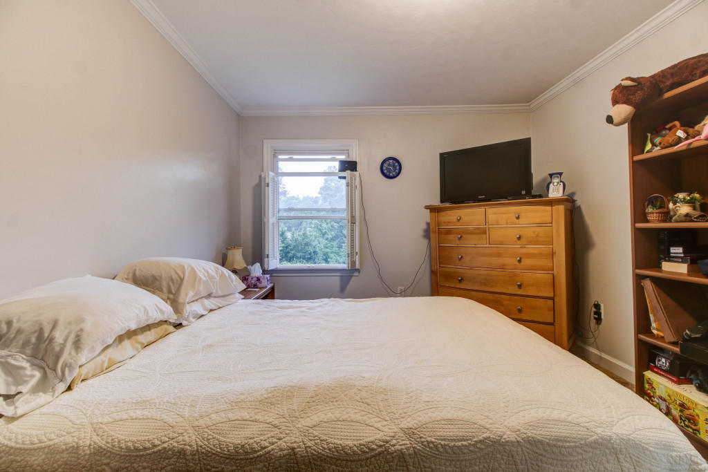 1400 Morgans Mill Road Goodview, VA 24095 - Photo 15 of 21 a bedroom with a bed and flat screen tv