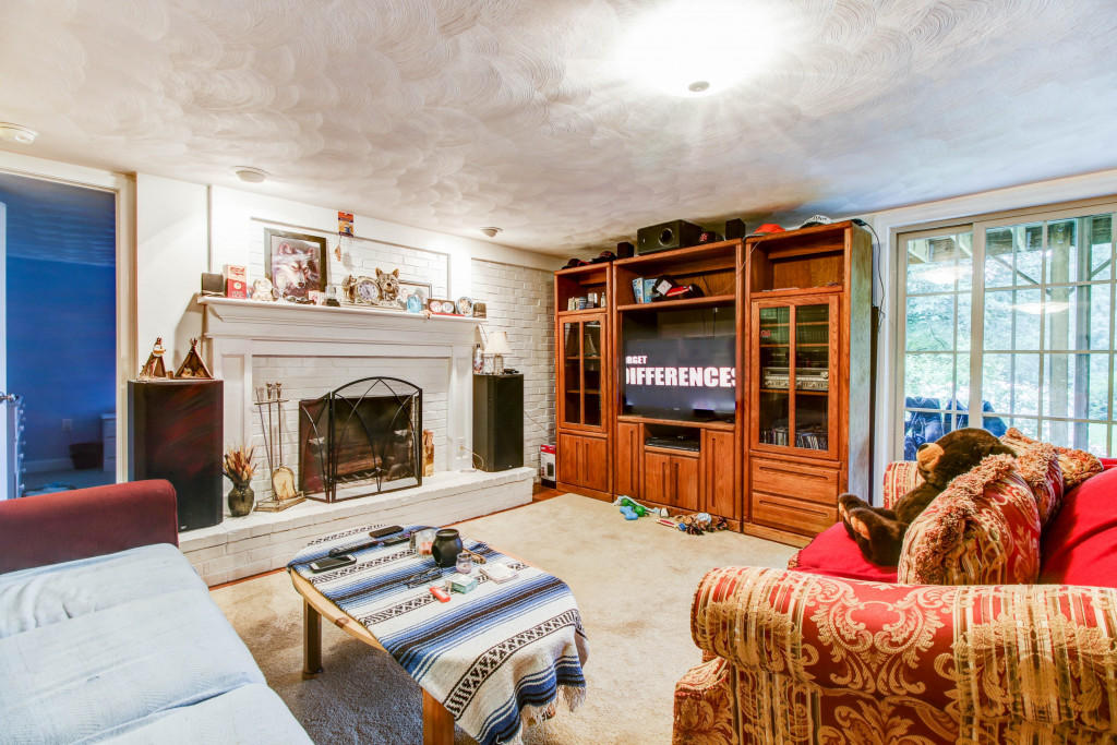 1400 Morgans Mill Road Goodview, VA 24095 - Photo 21 of 21 a living room with furniture and a fireplace