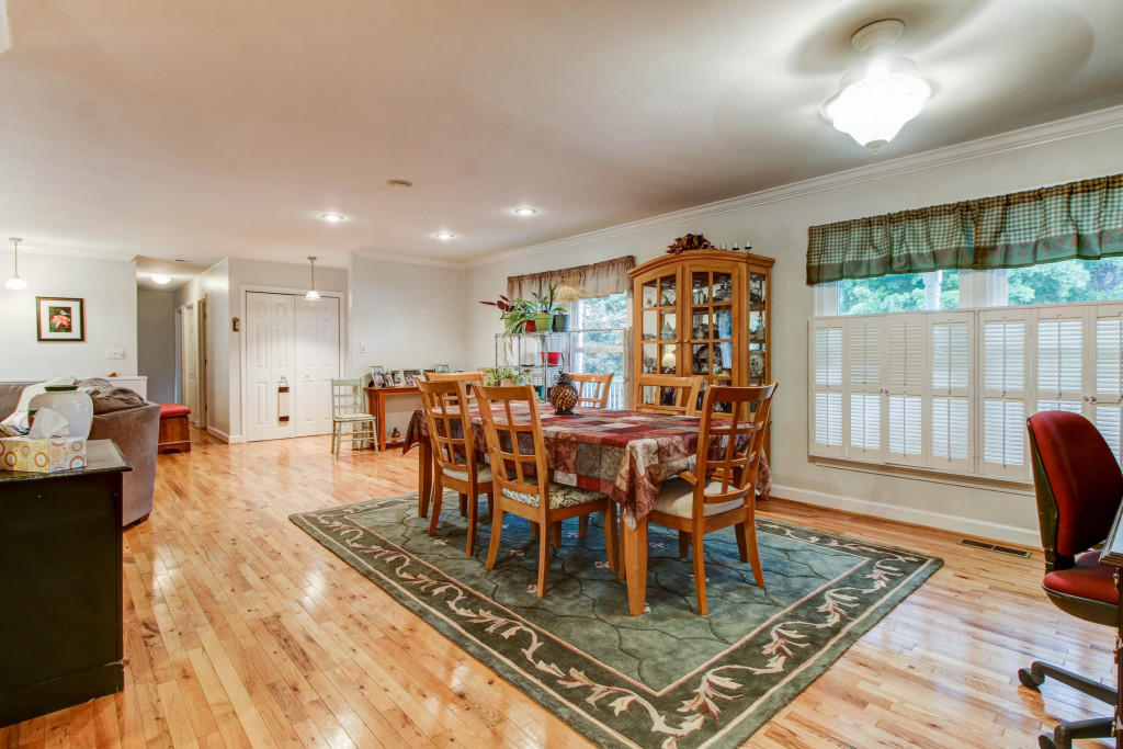 1400 Morgans Mill Road Goodview, VA 24095 - Photo 5 of 21 a view of a dining room with furniture window and wooden floor