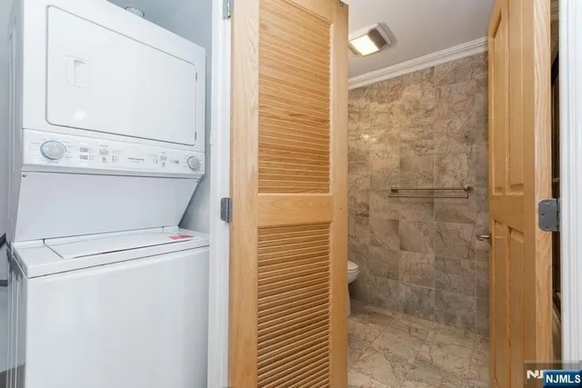 a view of bathroom with a shower and a sink