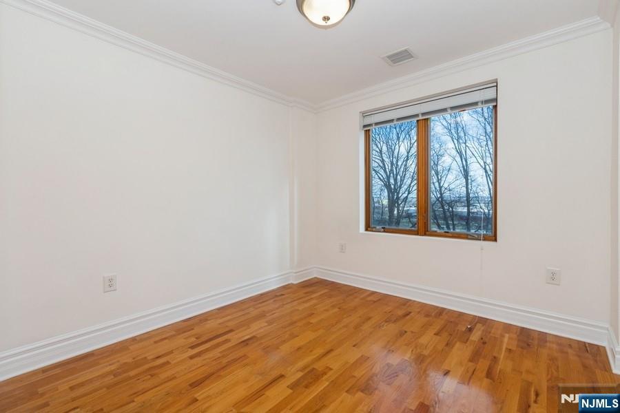 17 Meadow Road, Unit 405 Rutherford, NJ 07070 - Photo 10 of 18 an empty room with a window