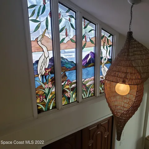a view of a livingroom with furniture and windows