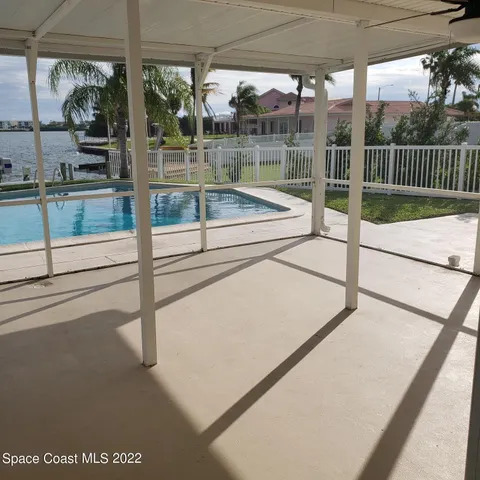 a view of a swimming pool and a chair