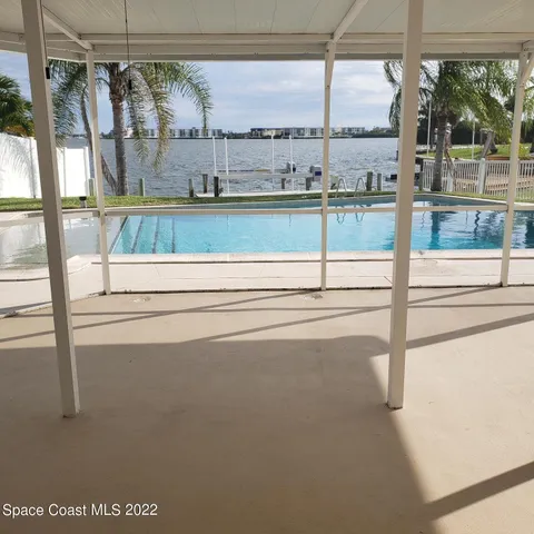 a view of roof deck with outdoor seating and city view