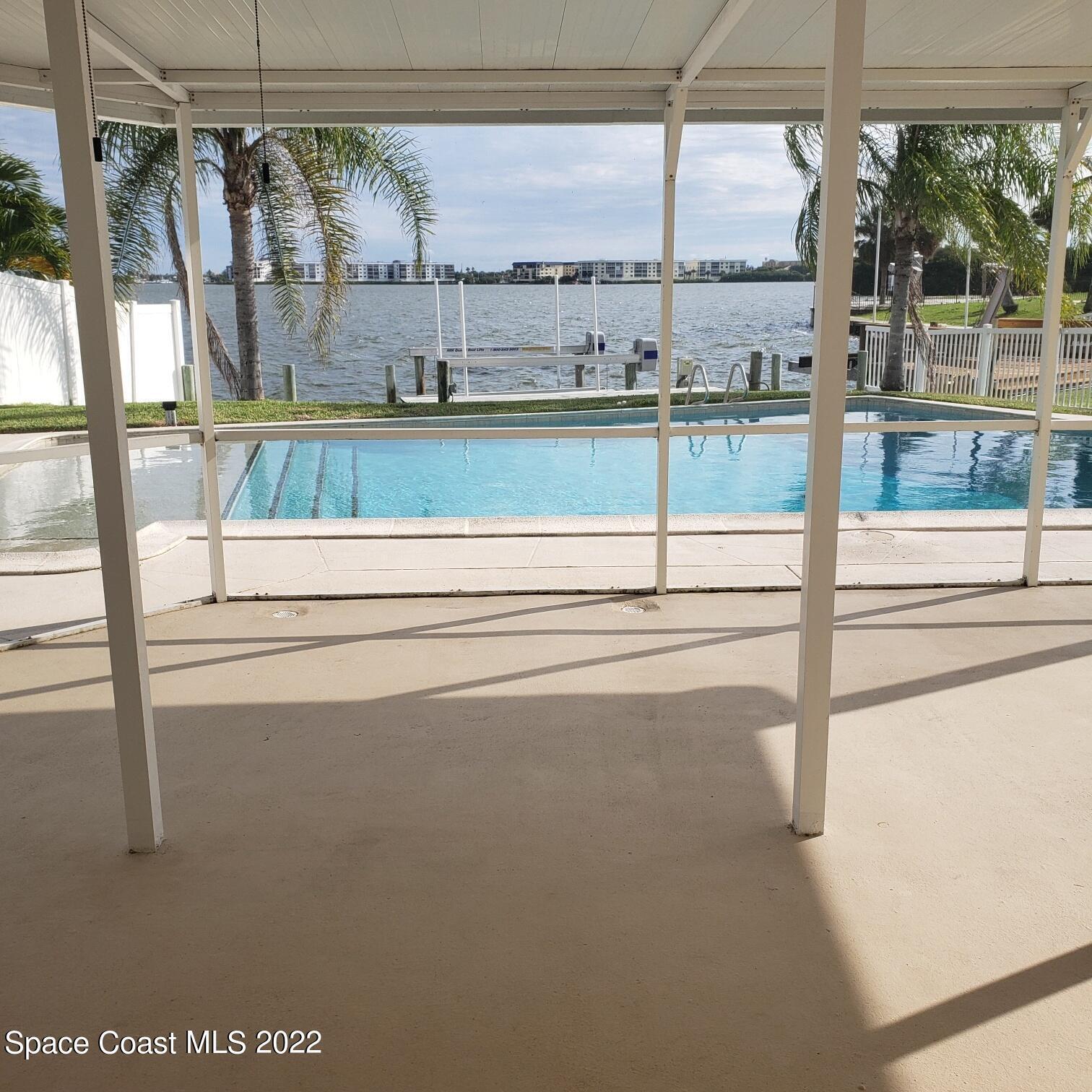 215 Andros Avenue Cocoa Beach, FL 32931 - Photo 32 of 55 a view of a floor and a floor to ceiling window
