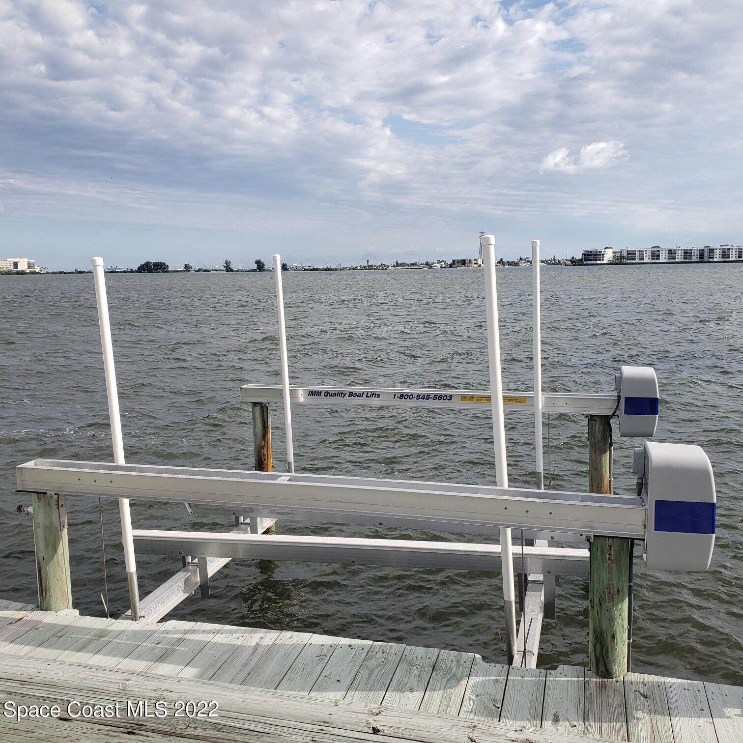 215 Andros Avenue Cocoa Beach, FL 32931 - Photo 36 of 55 a view of roof deck with outdoor seating and city view