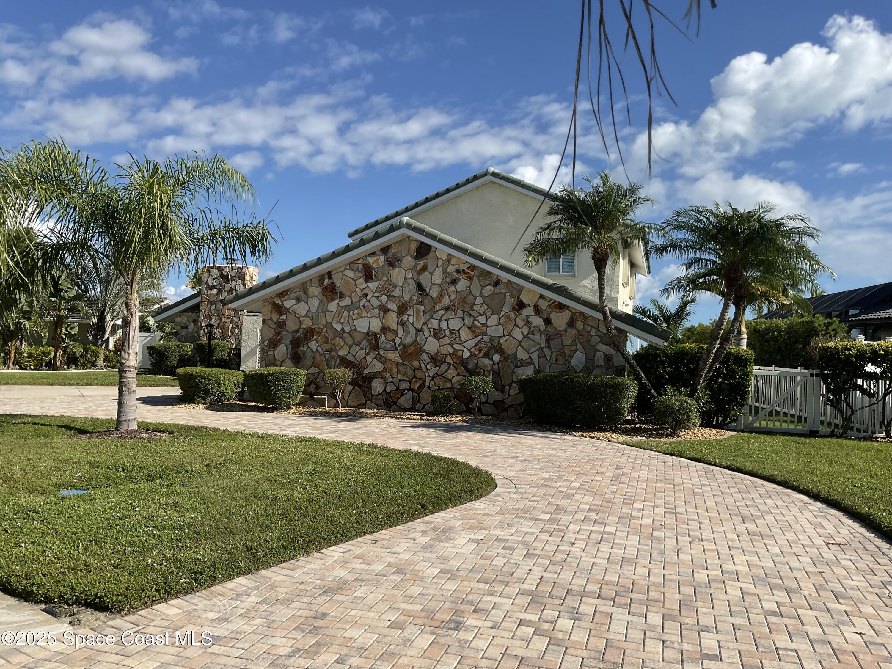 215 Andros Avenue Cocoa Beach, FL 32931 - Photo 4 of 55 a view of a backyard