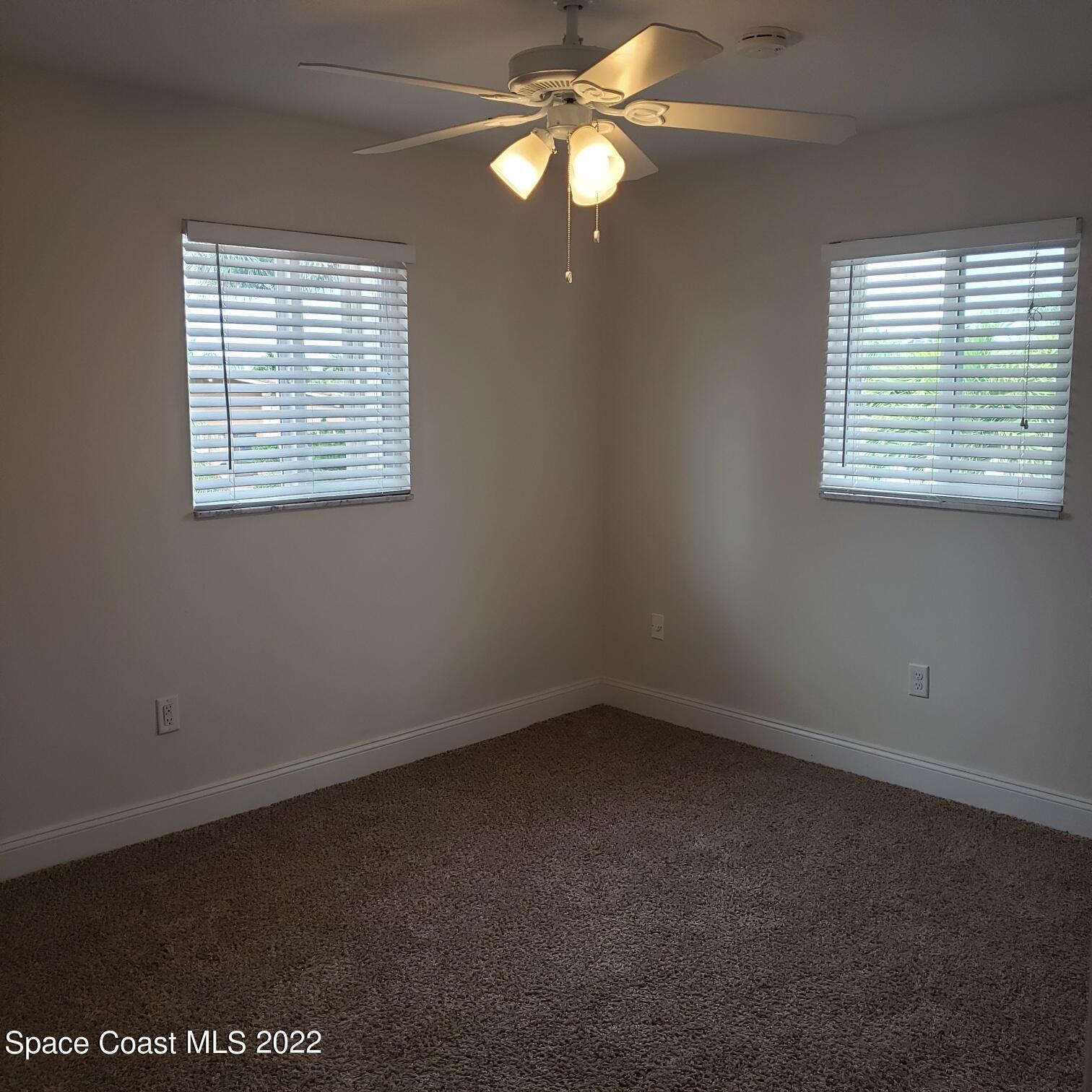 215 Andros Avenue Cocoa Beach, FL 32931 - Photo 43 of 53 an empty room with a window