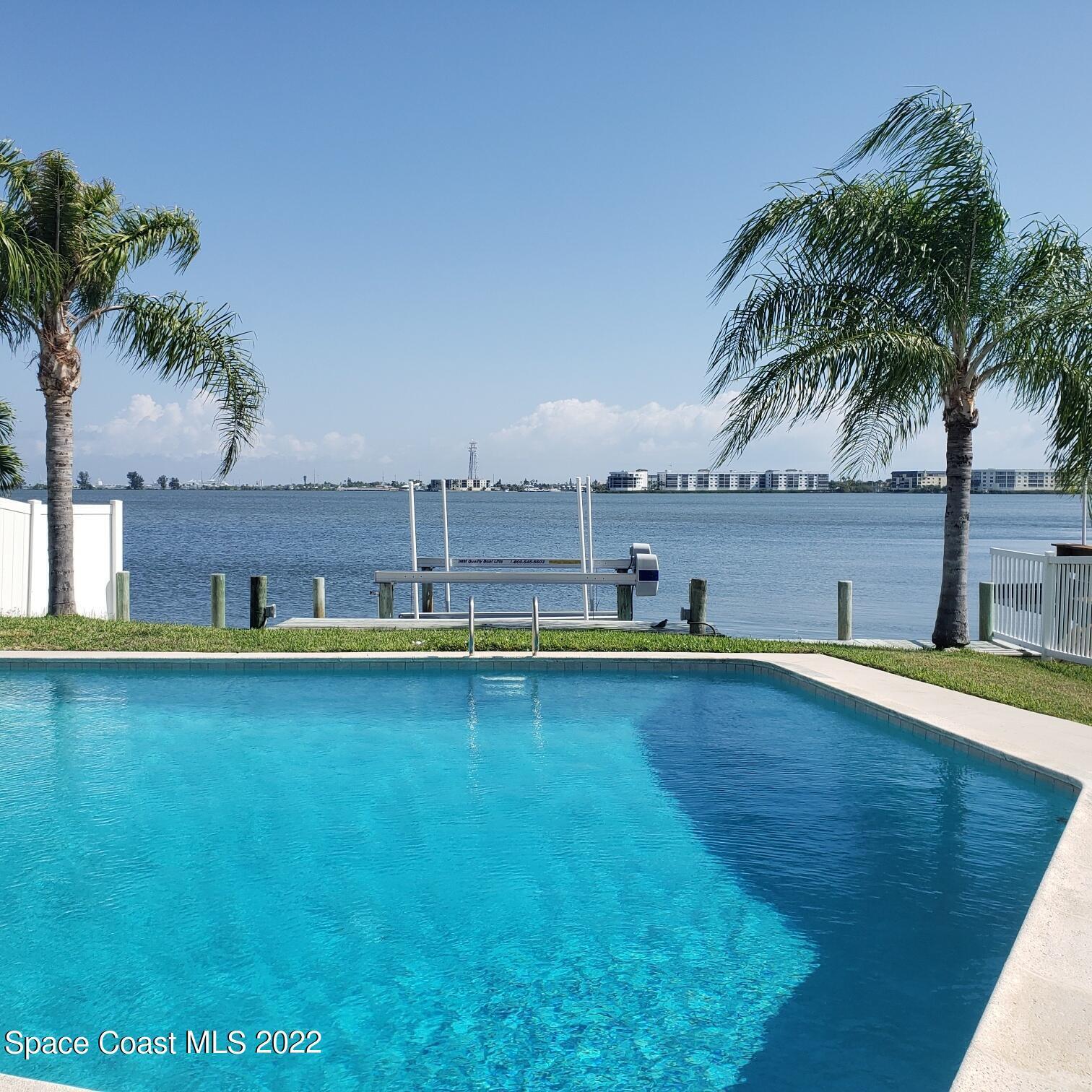 215 Andros Avenue Cocoa Beach, FL 32931 - Photo 49 of 55 a view of a swimming pool and an outdoor space