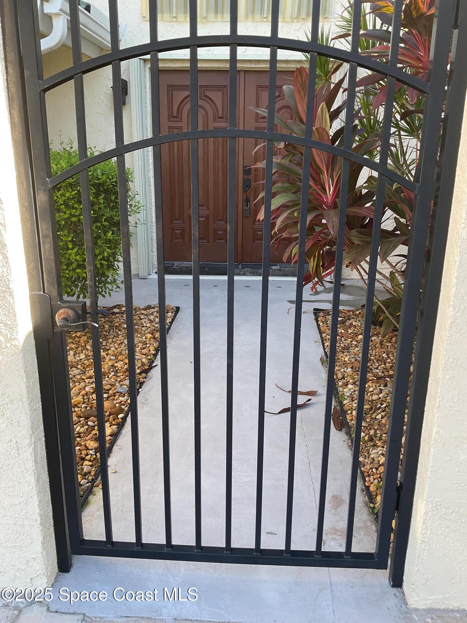 215 Andros Avenue Cocoa Beach, FL 32931 - Photo 9 of 55 a view of staircase with window