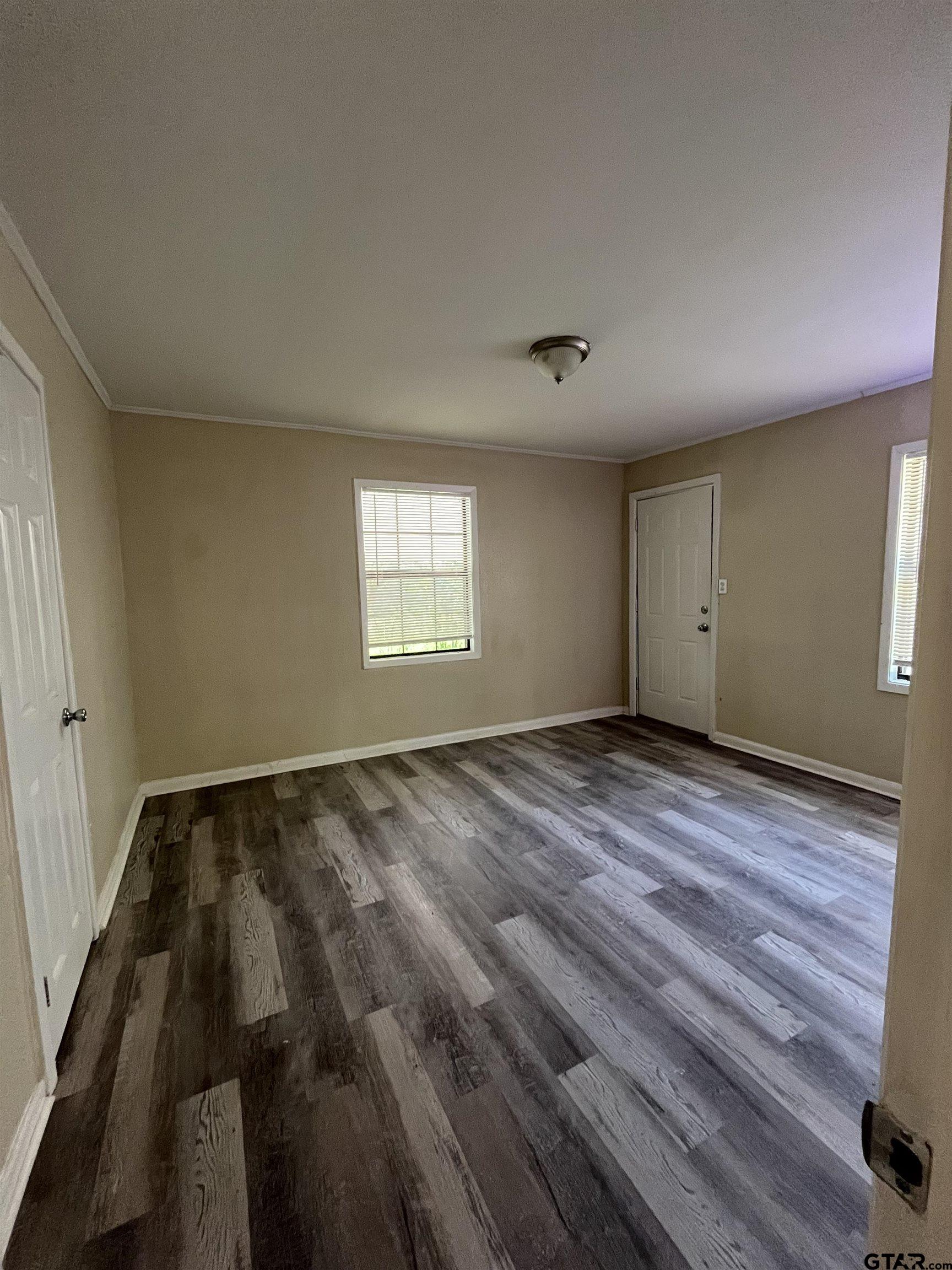 3312 North Luberta Street Tyler, TX 75702 - Photo 6 of 8 a view of an empty room and window