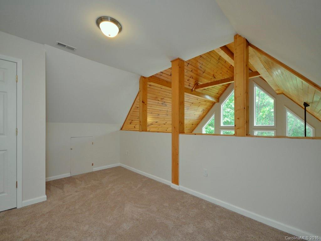 668 Mouzon Road Waynesville, NC 28785 - Photo 13 of 24 an empty room with a large window