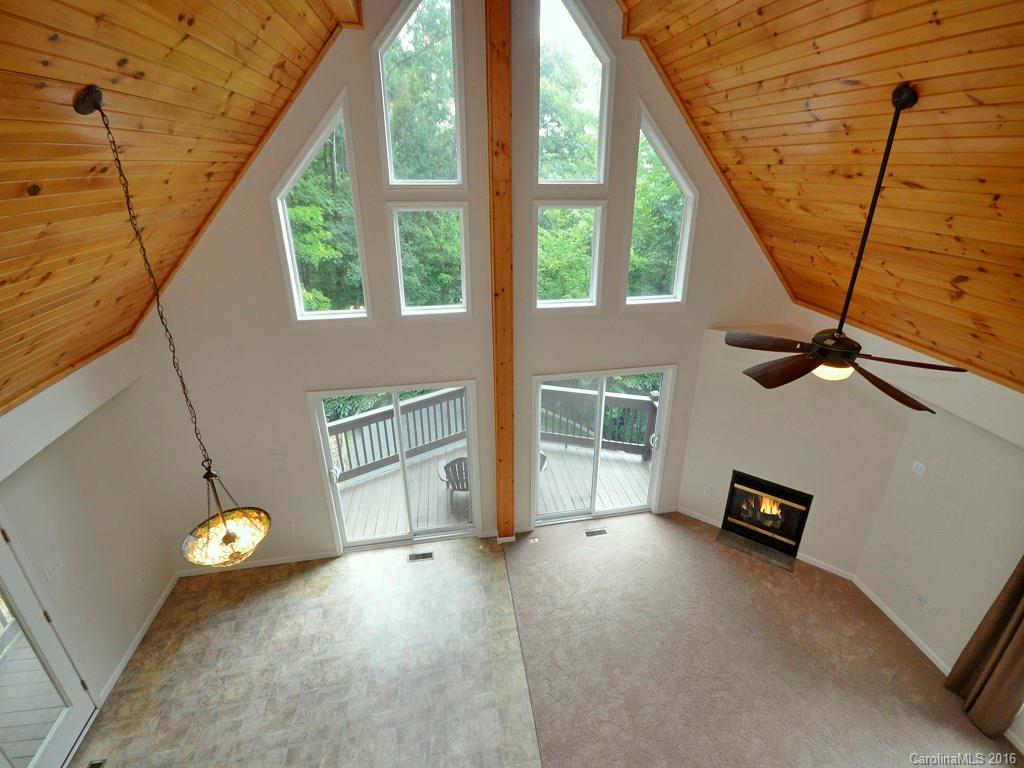 668 Mouzon Road Waynesville, NC 28785 - Photo 14 of 24 a view of an empty room with windows