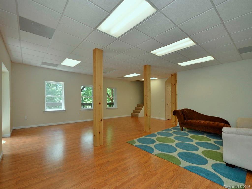 668 Mouzon Road Waynesville, NC 28785 - Photo 17 of 24 a lobby with furniture and floor to ceiling window