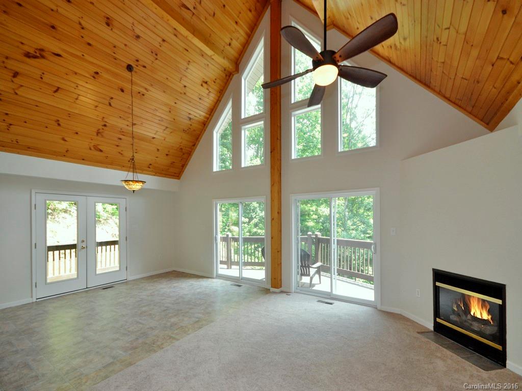 668 Mouzon Road Waynesville, NC 28785 - Photo 3 of 24 a view of an empty room with a window