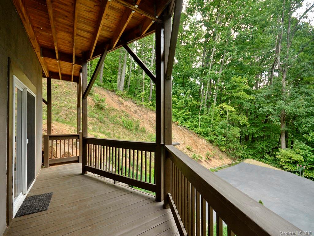 668 Mouzon Road Waynesville, NC 28785 - Photo 22 of 24 a view of a porch with wooden floor and outdoor space