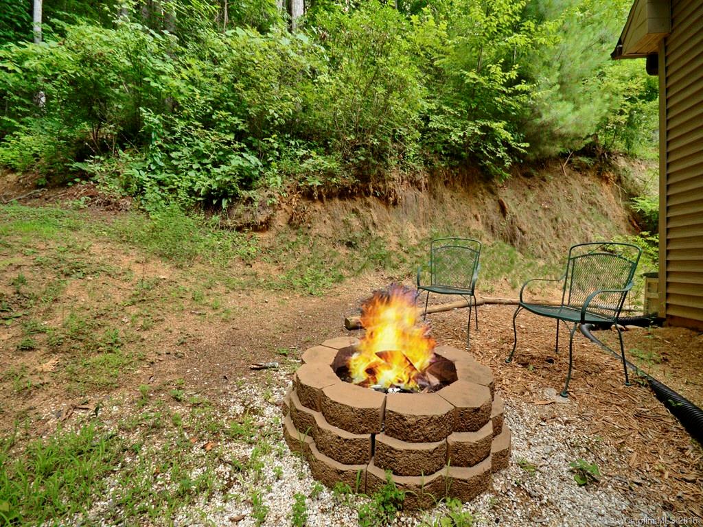 668 Mouzon Road Waynesville, NC 28785 - Photo 23 of 24 a view of a garden with a fountain
