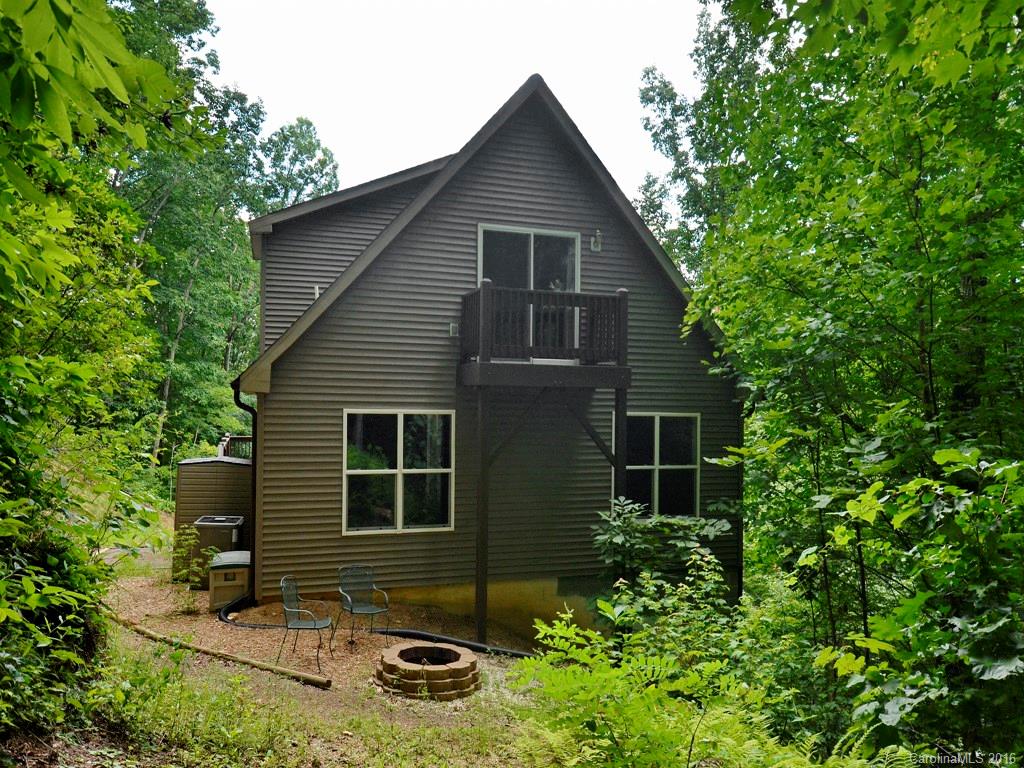 668 Mouzon Road Waynesville, NC 28785 - Photo 24 of 24 a front view of a house with yard and trees in the background