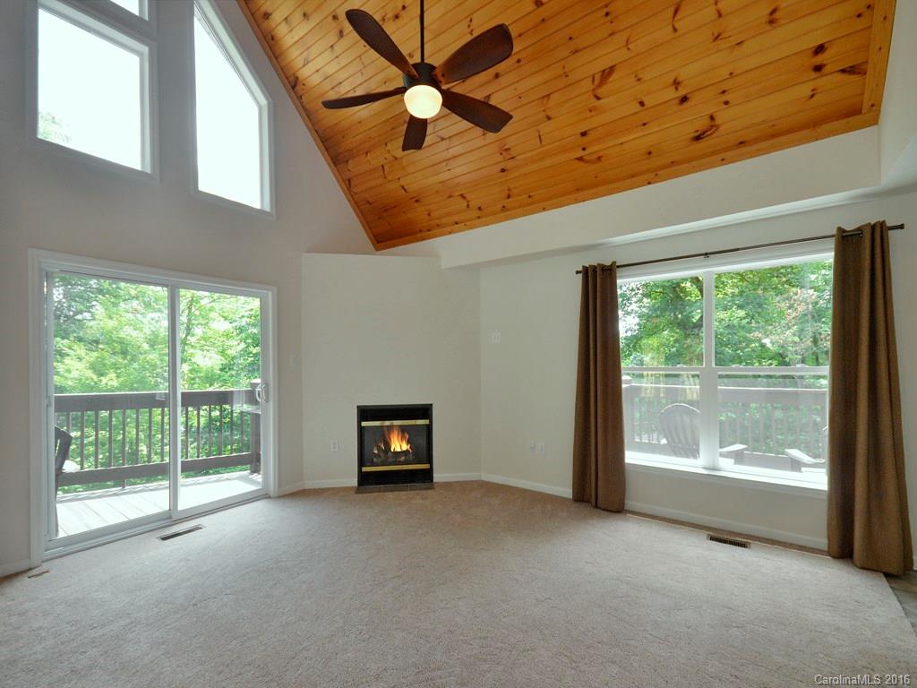 668 Mouzon Road Waynesville, NC 28785 - Photo 4 of 24 a view of a room with window and ceiling fan