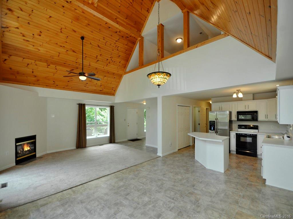 668 Mouzon Road Waynesville, NC 28785 - Photo 7 of 24 a view of a kitchen with a sink and a refrigerator