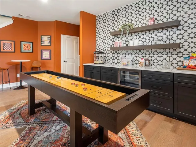 a view of an empty room with a fireplace and a window