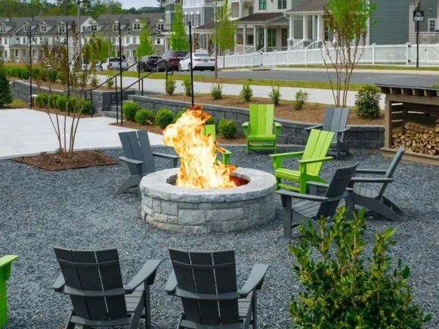 a view of a garden with lawn chairs