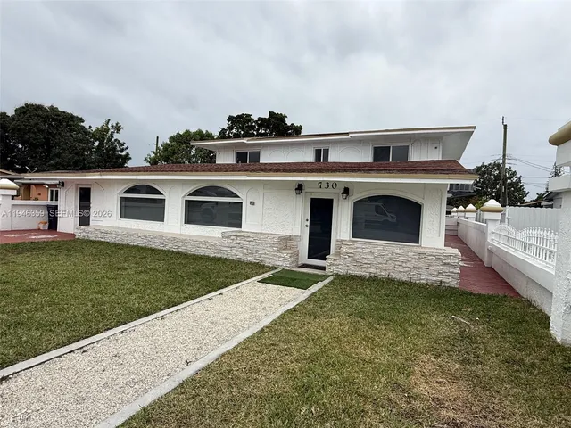 a front view of a house with a garage