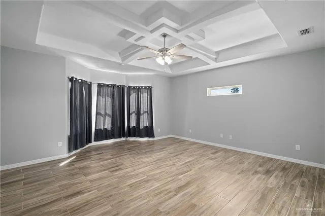 a bathroom with a sink mirror vanity and toilet