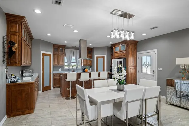 a kitchen with a sink cabinets and window