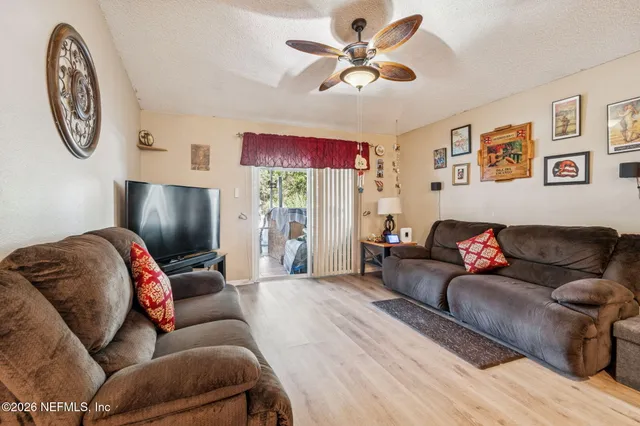 a kitchen with lots of counter top space appliances and cabinets