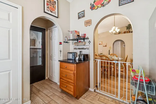 a view of walk in closet with clothes