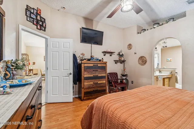 a view of a patio with a table chairs and a backyard