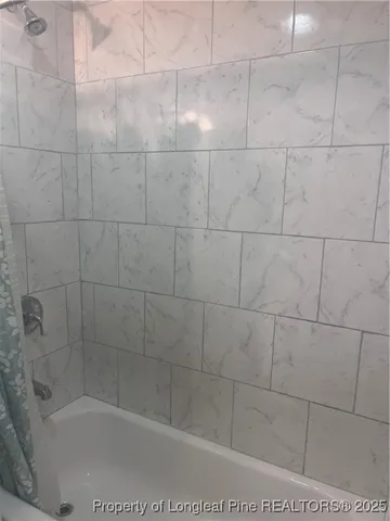 a view of brick house with a large window