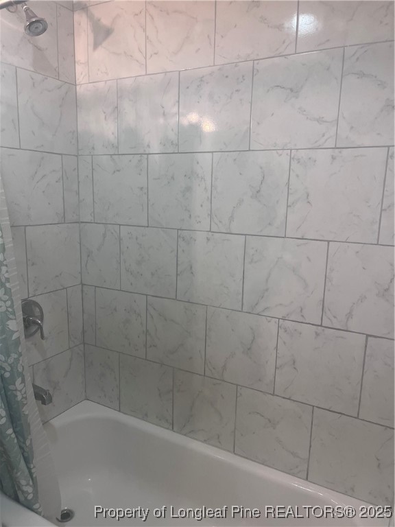 302 Keith Avenue Raeford, NC 28376 - Photo 13 of 14 a bathroom with a shower