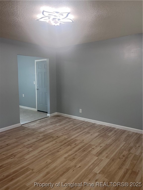 302 Keith Avenue Raeford, NC 28376 - Photo 2 of 14 a view of empty room with wooden floor