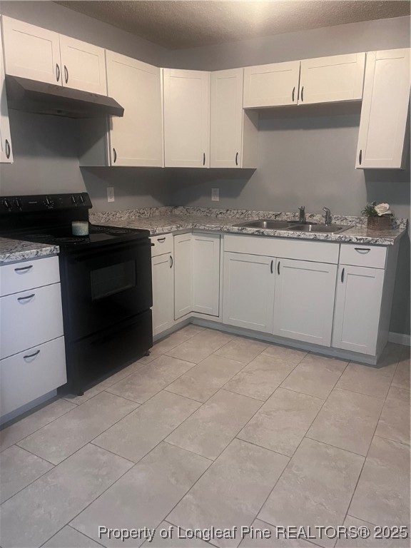 302 Keith Avenue Raeford, NC 28376 - Photo 7 of 14 a kitchen with granite countertop cabinets and steel stainless steel appliances