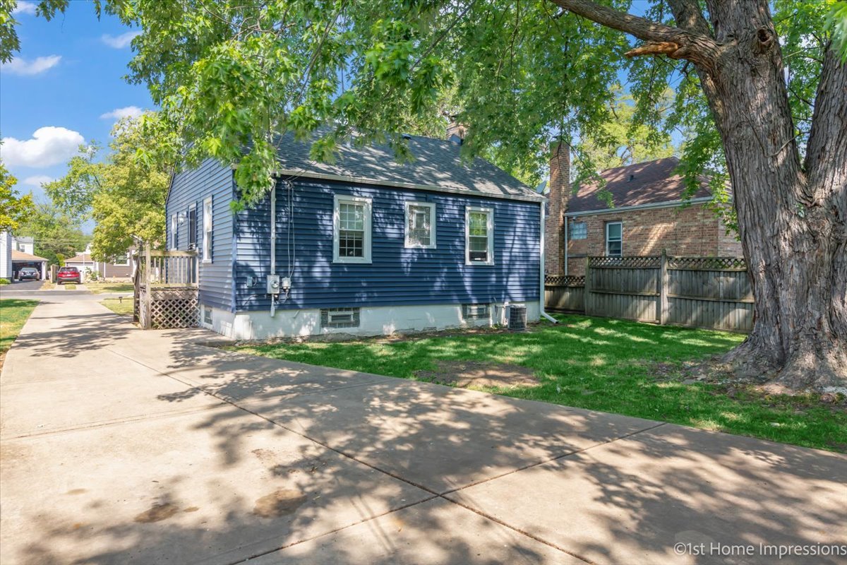 2425 South 13th Avenue Broadview, IL 60155 - Photo 11 of 13 a front view of a house with a garden