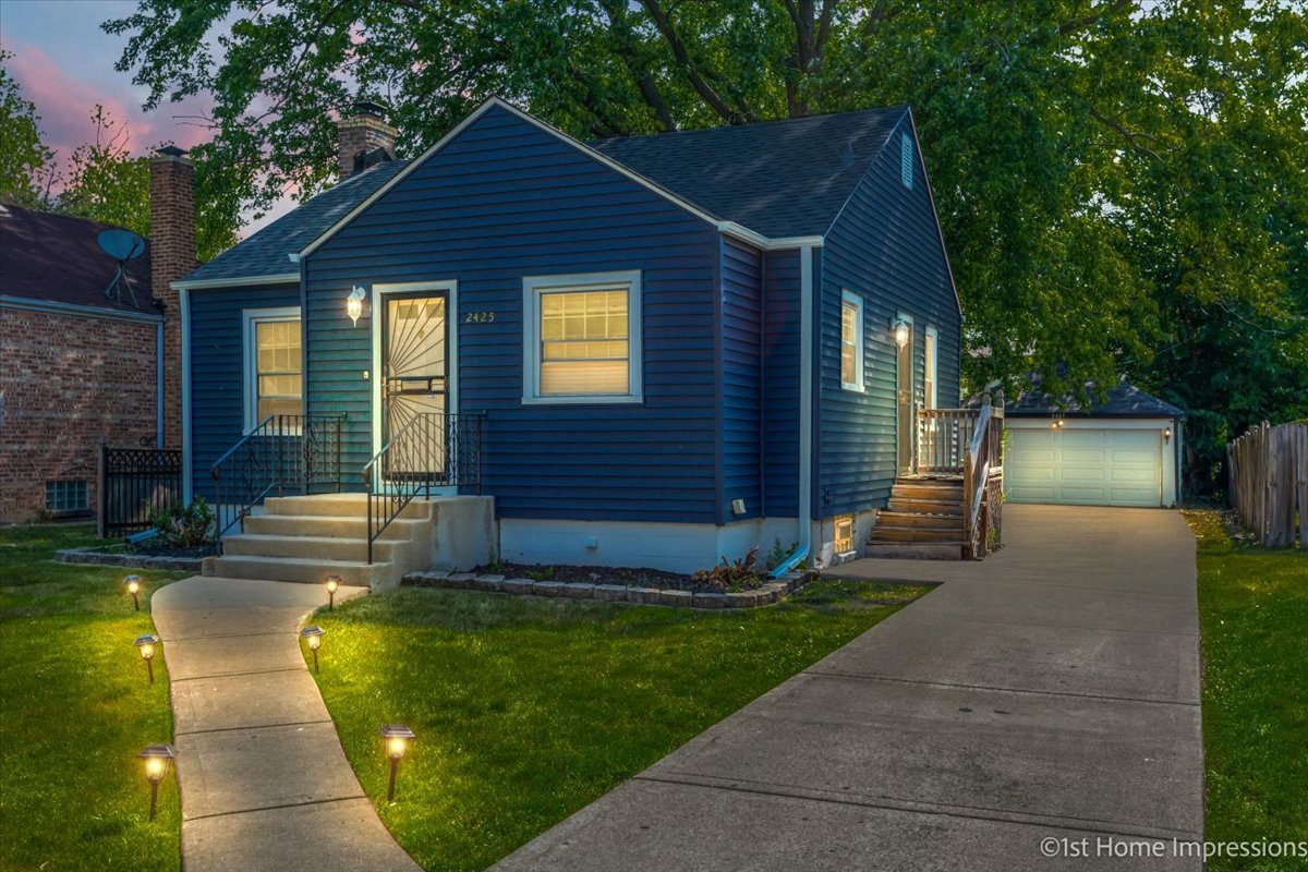2425 South 13th Avenue Broadview, IL 60155 - Photo 2 of 13 a front view of a house with a yard