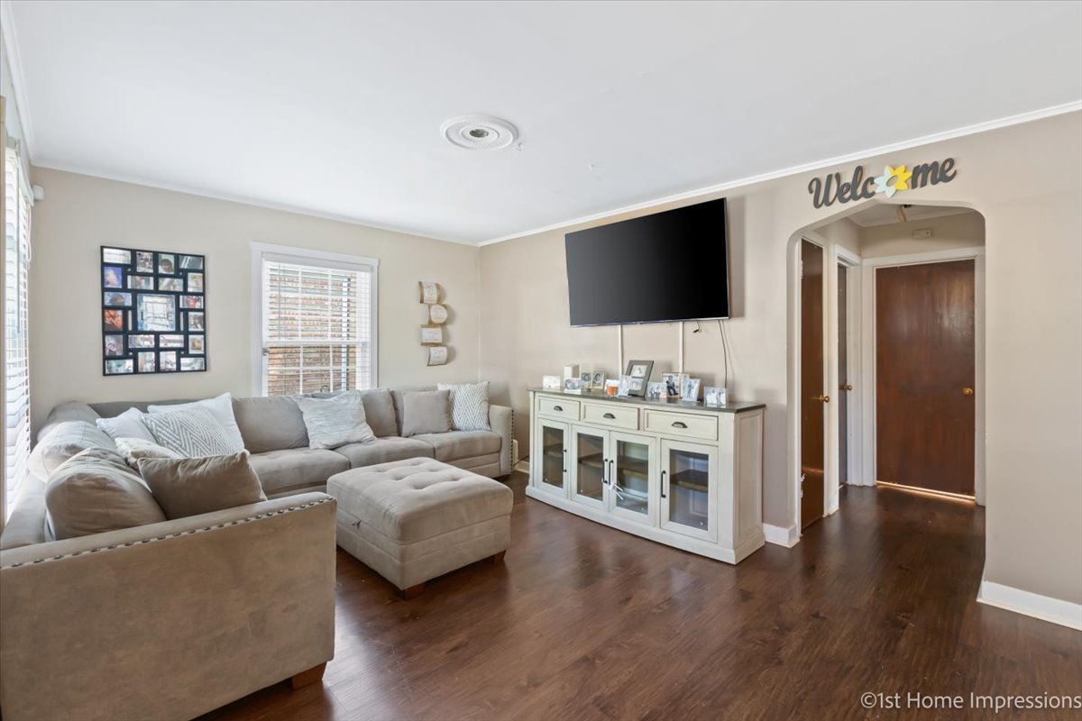 2425 South 13th Avenue Broadview, IL 60155 - Photo 3 of 13 a living room with furniture and a flat screen tv