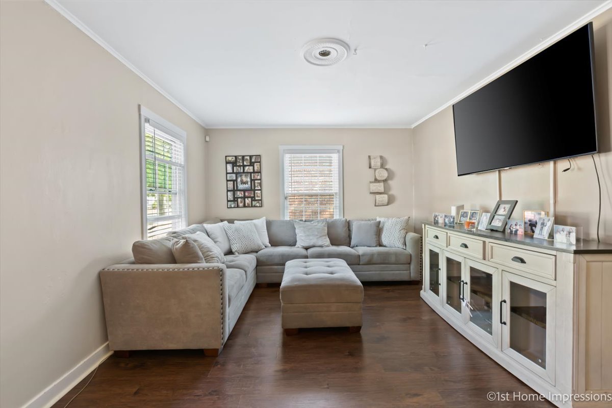 2425 South 13th Avenue Broadview, IL 60155 - Photo 4 of 13 a living room with furniture and a flat screen tv