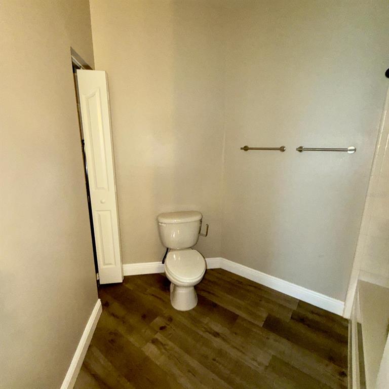 12861 Madison Pointe Circle, Unit 101 Orlando, FL 32821 - Photo 17 of 30 a bathroom with a toilet and a sink