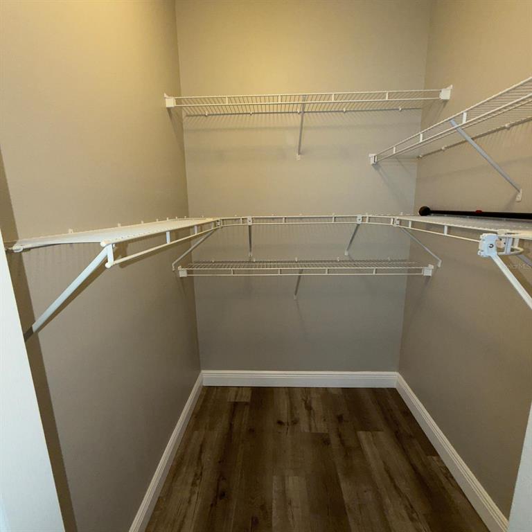 12861 Madison Pointe Circle, Unit 101 Orlando, FL 32821 - Photo 20 of 30 a view of a room with racks on the wall